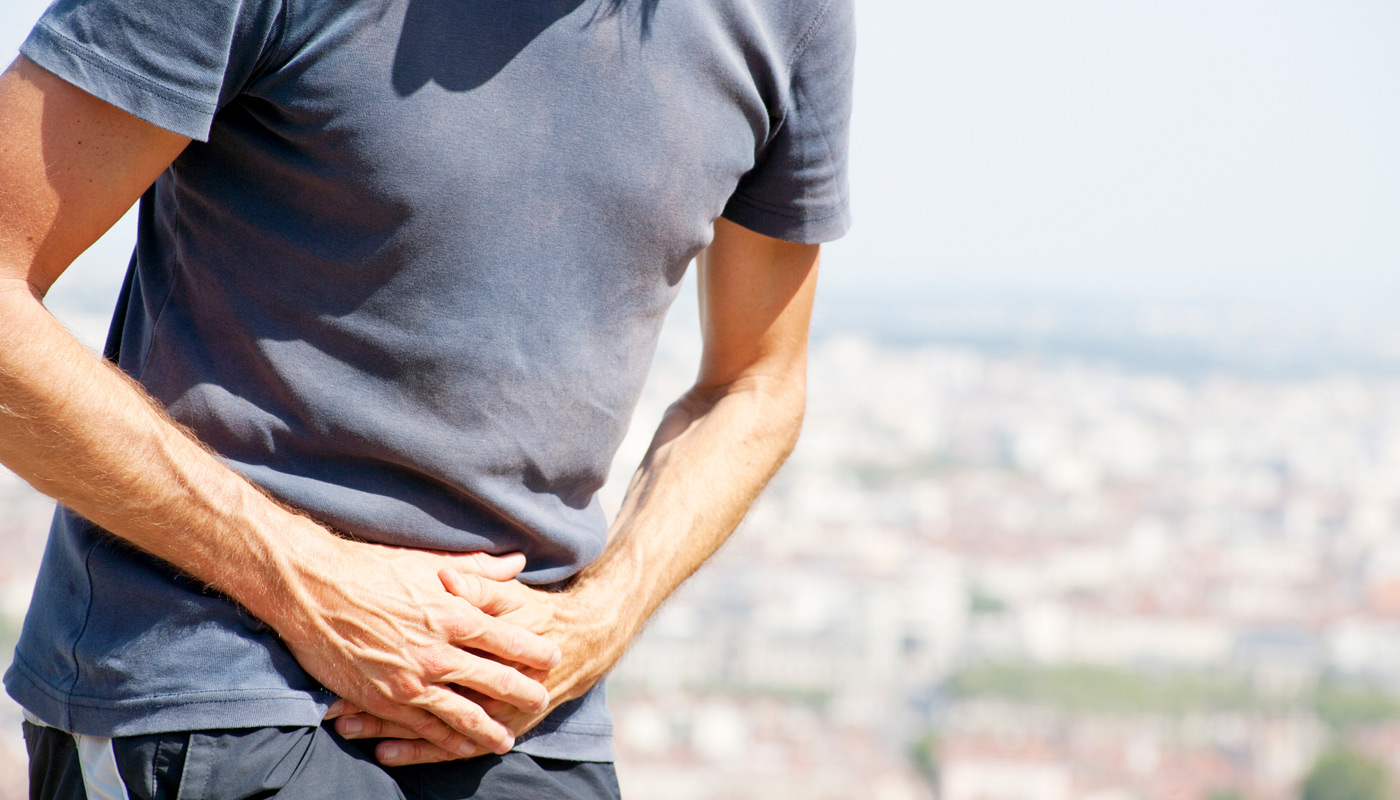Man-experiencing-symptoms-of-ureteral-obstruction