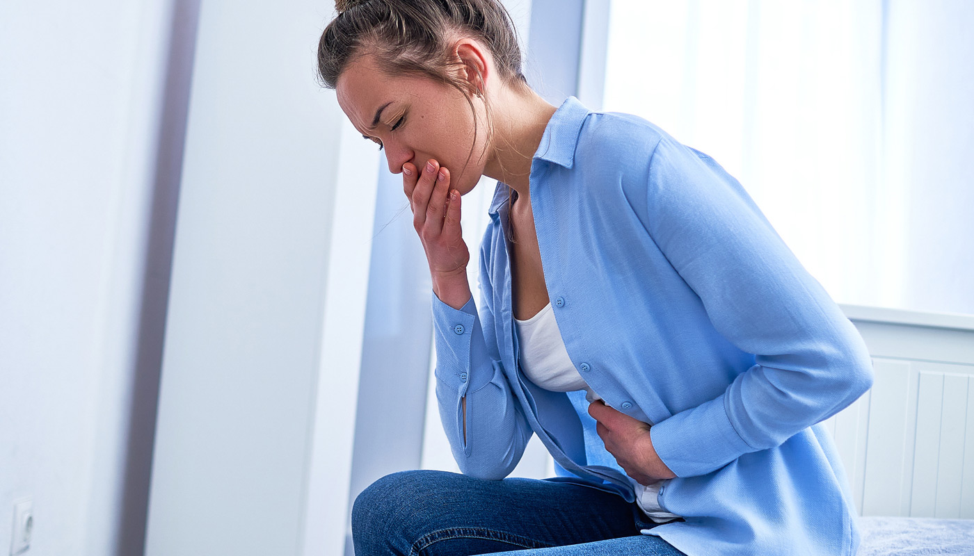 Woman-feeling-nauseous-from-rectovaginal-fistula
