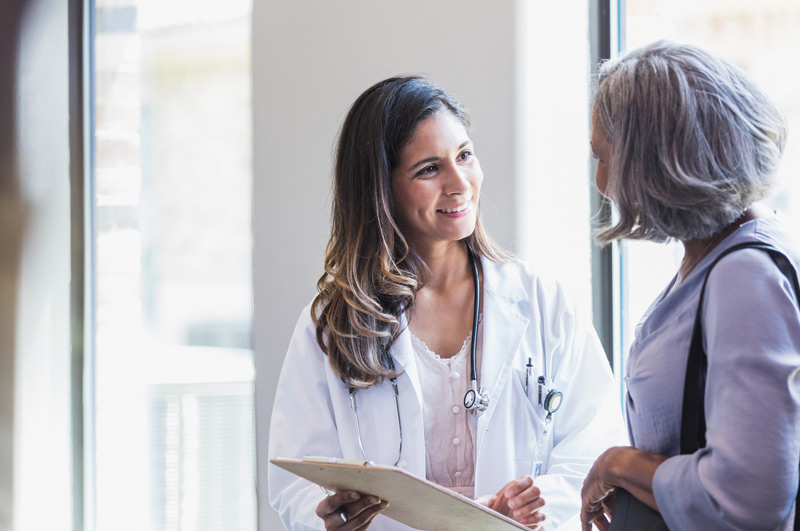 Doctor-explaining-labiaplasty-procedure-to-patient