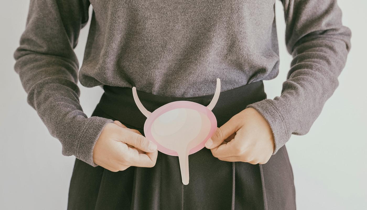 woman-holding-bladder-illustration