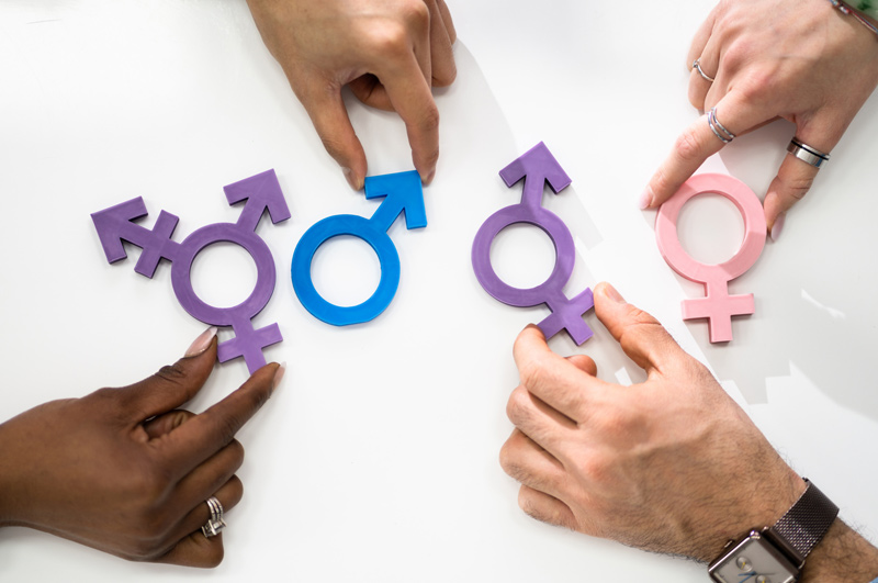 gender-signs-on-white-table